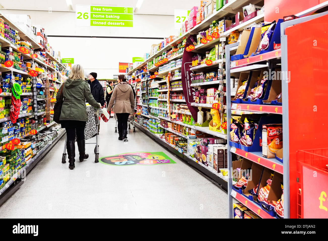 Shoppers in an Asda supermarket in the UK. Stock Photo