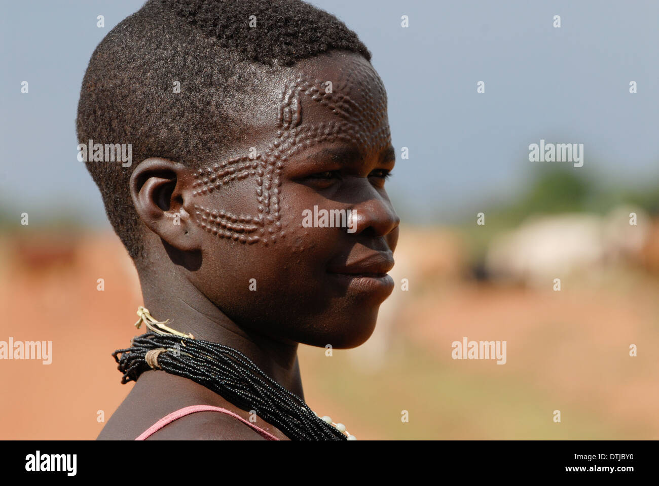 Uganda Karamoja Kotido, Karimojong people, pastoral tribe, woman with face scarification Stock Photo