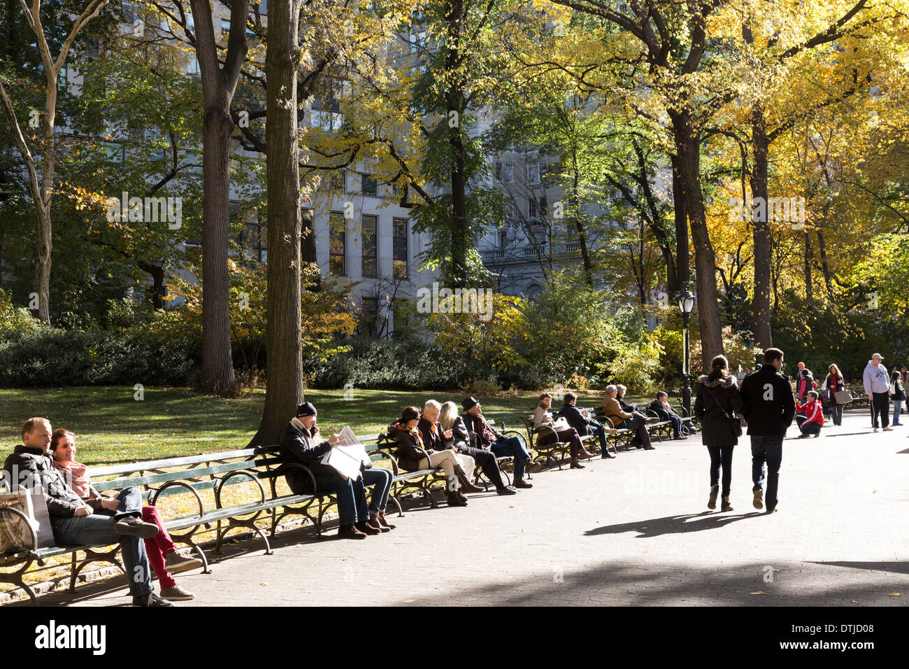 People Enjoying Autumn Trees and Foliage in Central Park, NYC Stock Photo