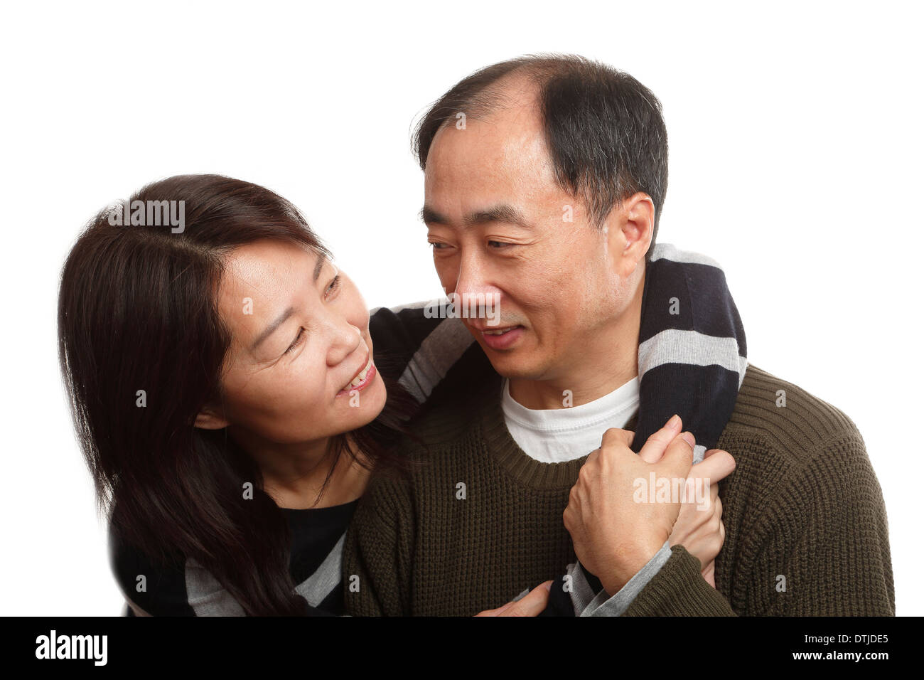 Asian middle age couple together on white background Stock Photo - Alamy