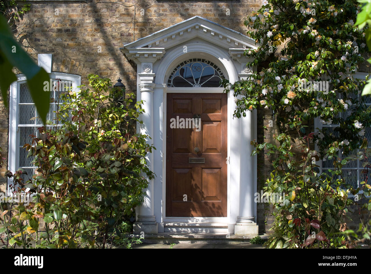Entrance Into A House With Grand Door With Window Lights