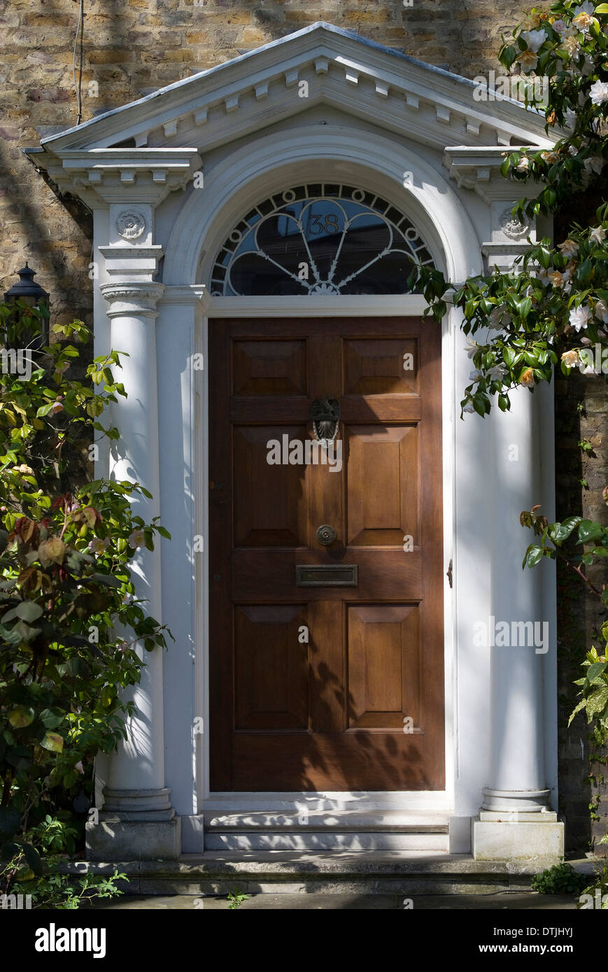 Entrance Into A House With Grand Door With Window Lights
