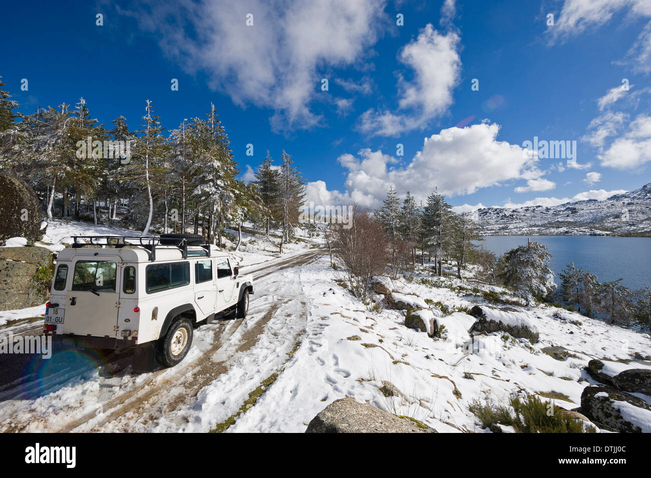 Land Rover Defender 4x4 vehicle on snowy landscape Stock Photo
