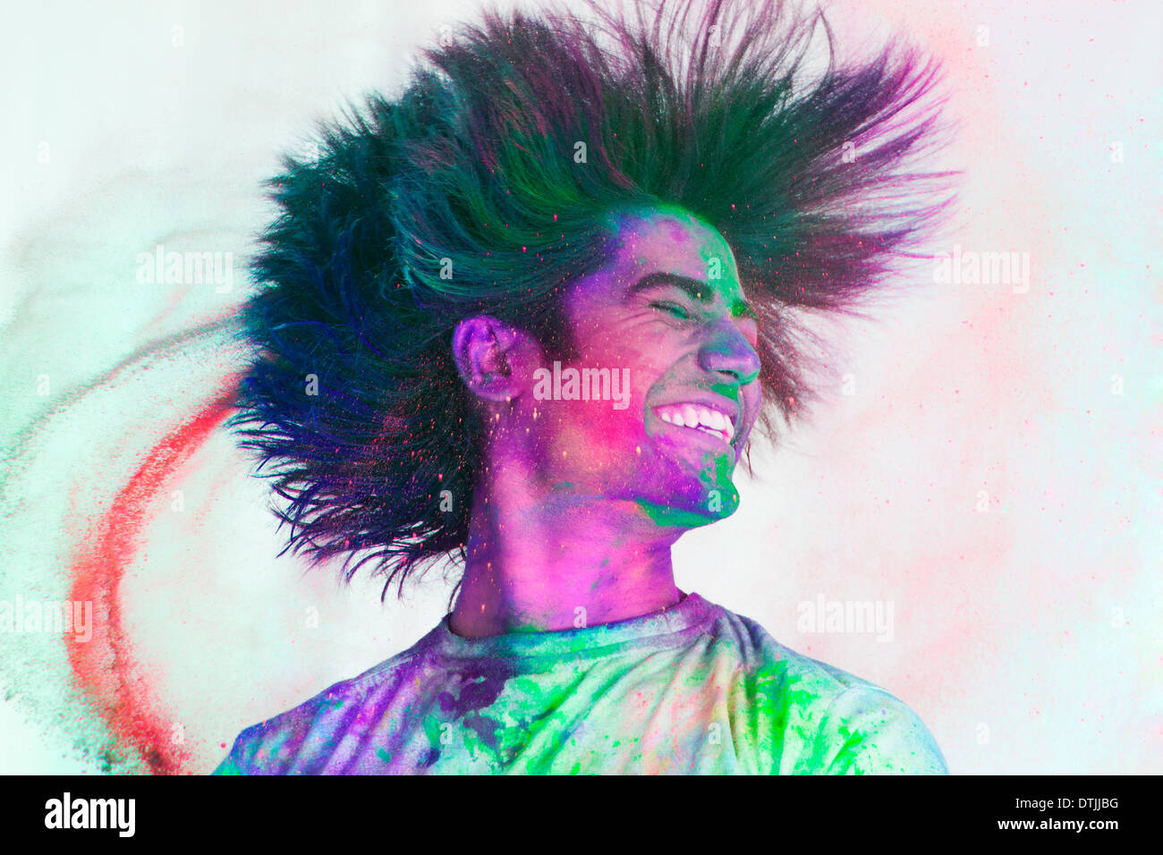 man celebrating Holi festival of colours with powder Stock Photo