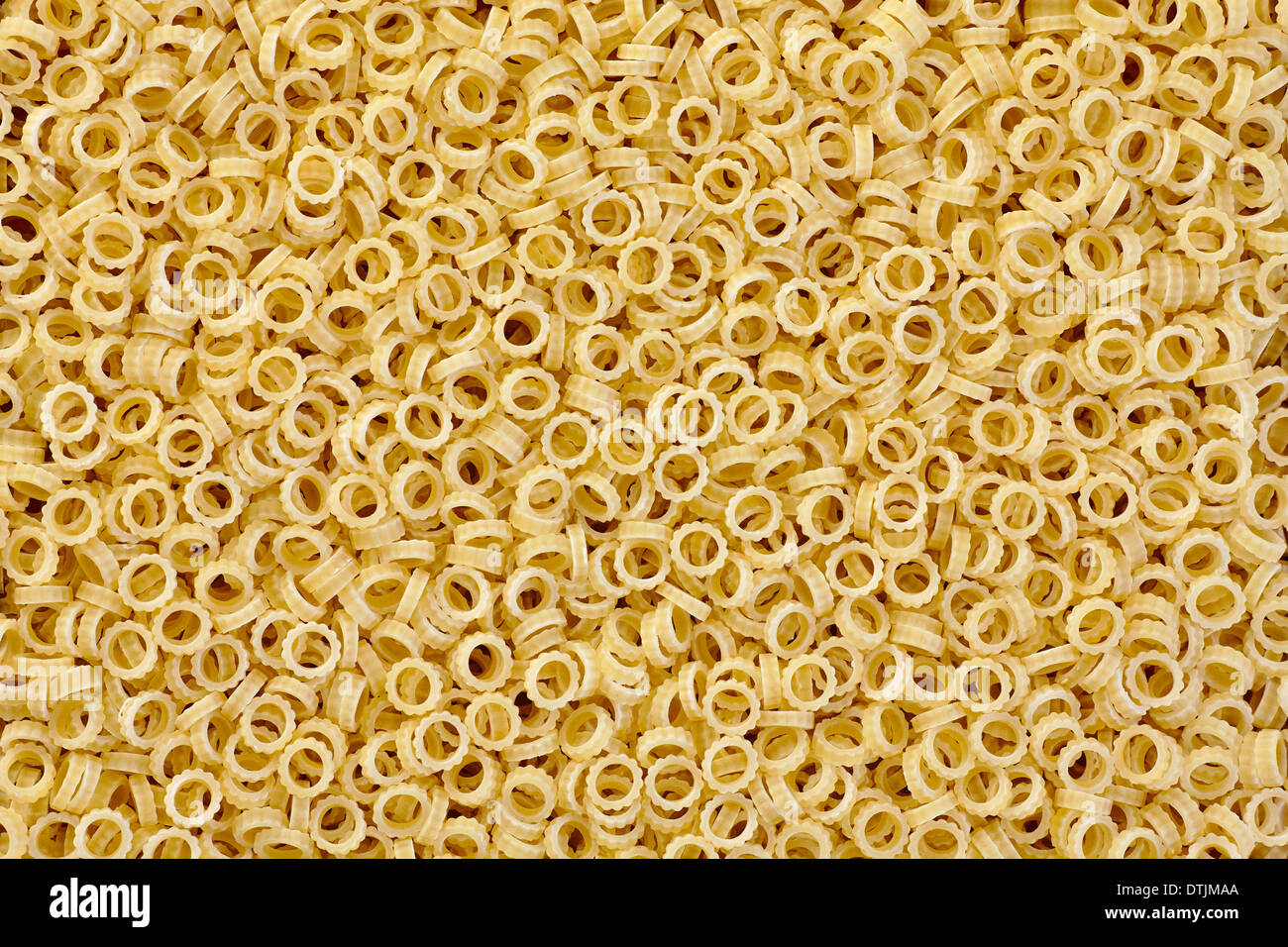 Anelli small thin rings of pasta background Stock Photo - Alamy