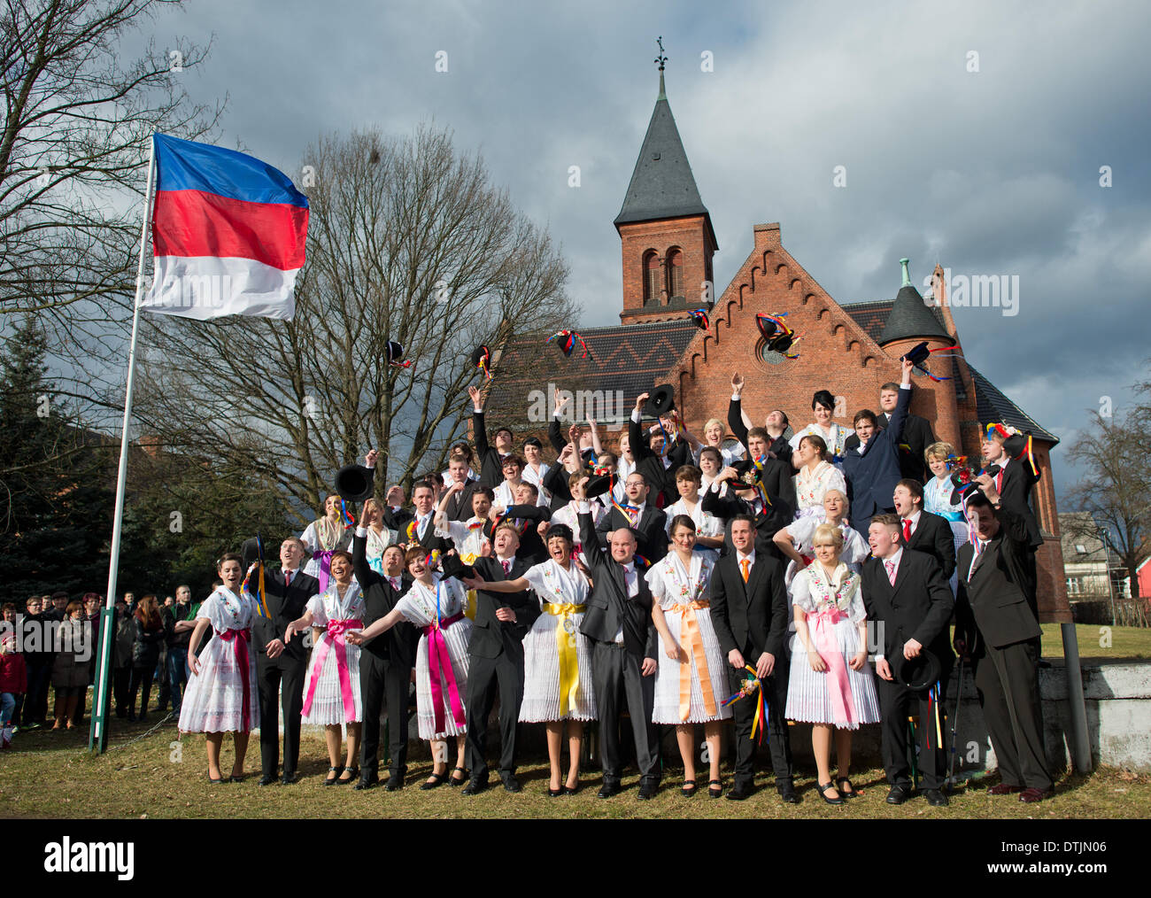 Drachhausen, Germany. 16th Feb, 2014. Unmarried couples in traditional Sorbian festive costumes attend the traditional Zapust of the Sorbian-Wendish youth carnival in Drachhausen, Germany, 16 February 2014. Zapust is the most popular tradition of the Sorbs. The carnival procession in the villages of Lusatia is held to expel the winter. Photo: Patrick Pleul/ZB/dpa/Alamy Live News Stock Photo