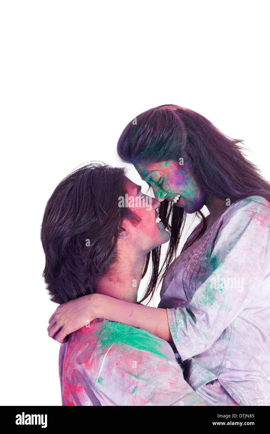 Couple playing holi festival Stock Photo - Alamy