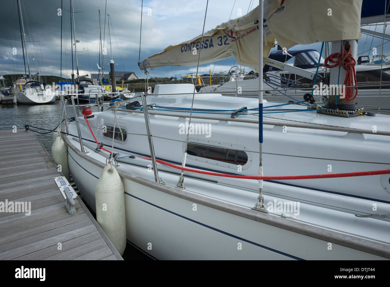 Contessa 32 :Classic 1970s sailing boat berthed prior to end of season lifting out Stock Photo