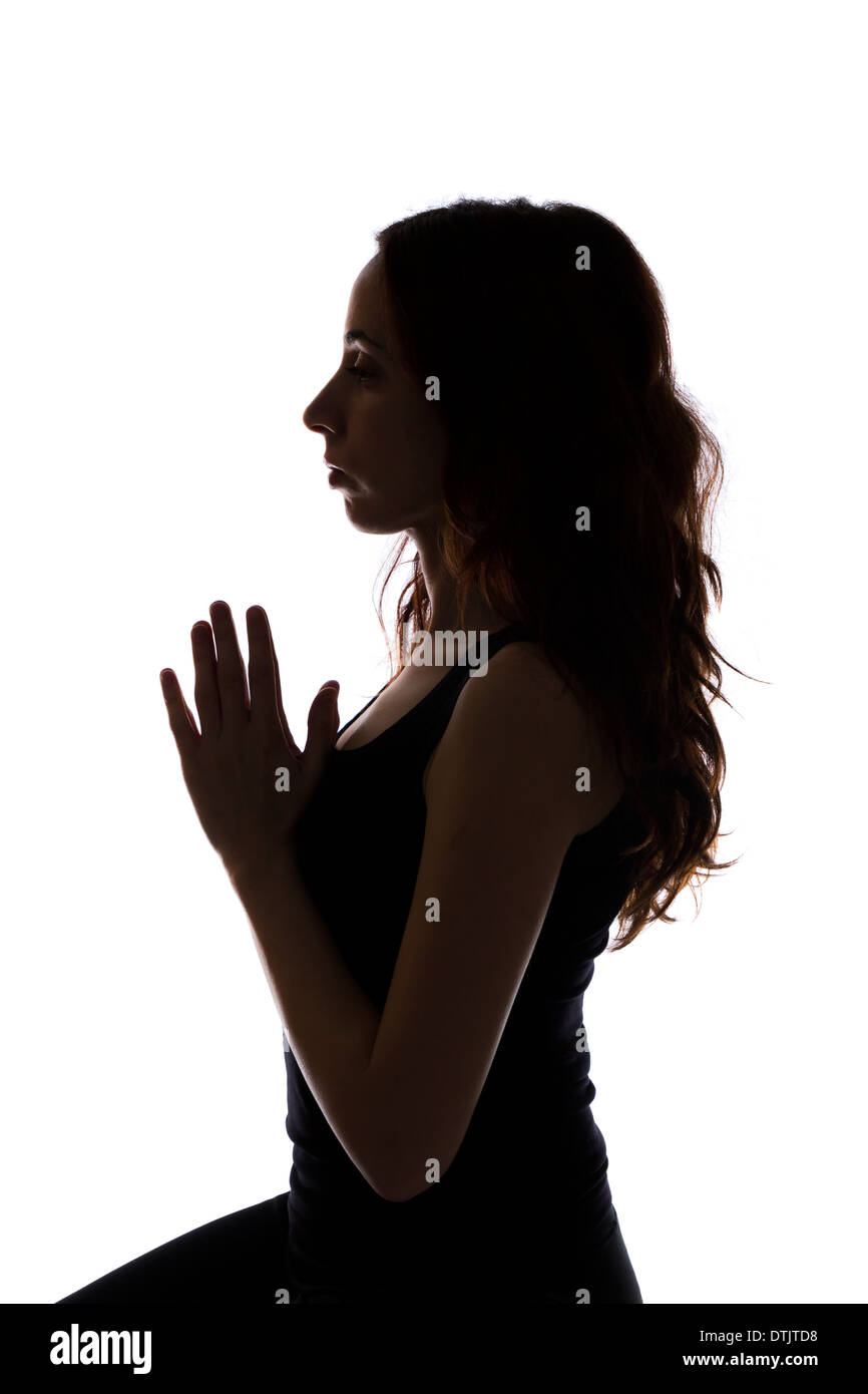 Woman doing meditation, Silhouette (Series with the same model available) Stock Photo