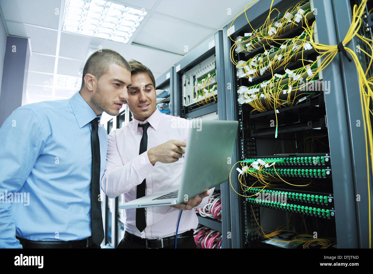 it engineers in network server room Stock Photo - Alamy