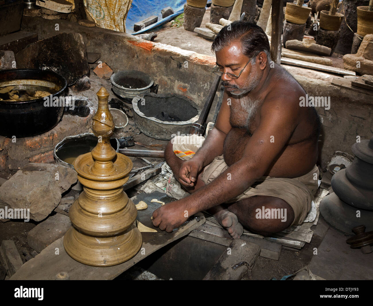 India, Kerala, Mannar, metal foundry, lost wax process casting man