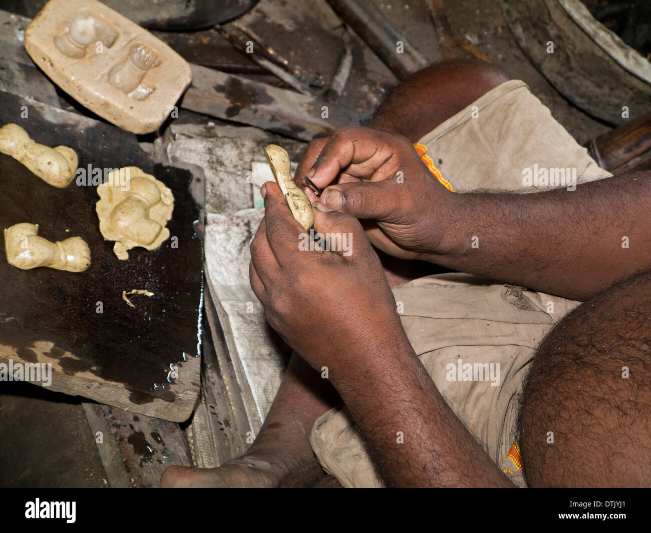 India, Kerala, Mannar, metal foundry, lost wax process casting hands of