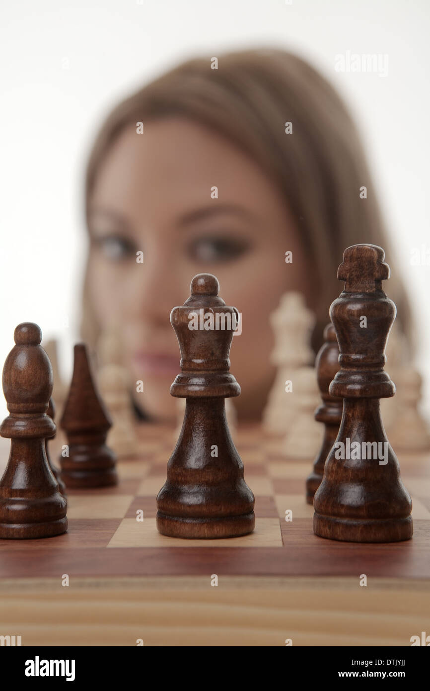 Image of a businesswoman playing chess shot in the studio Stock Photo