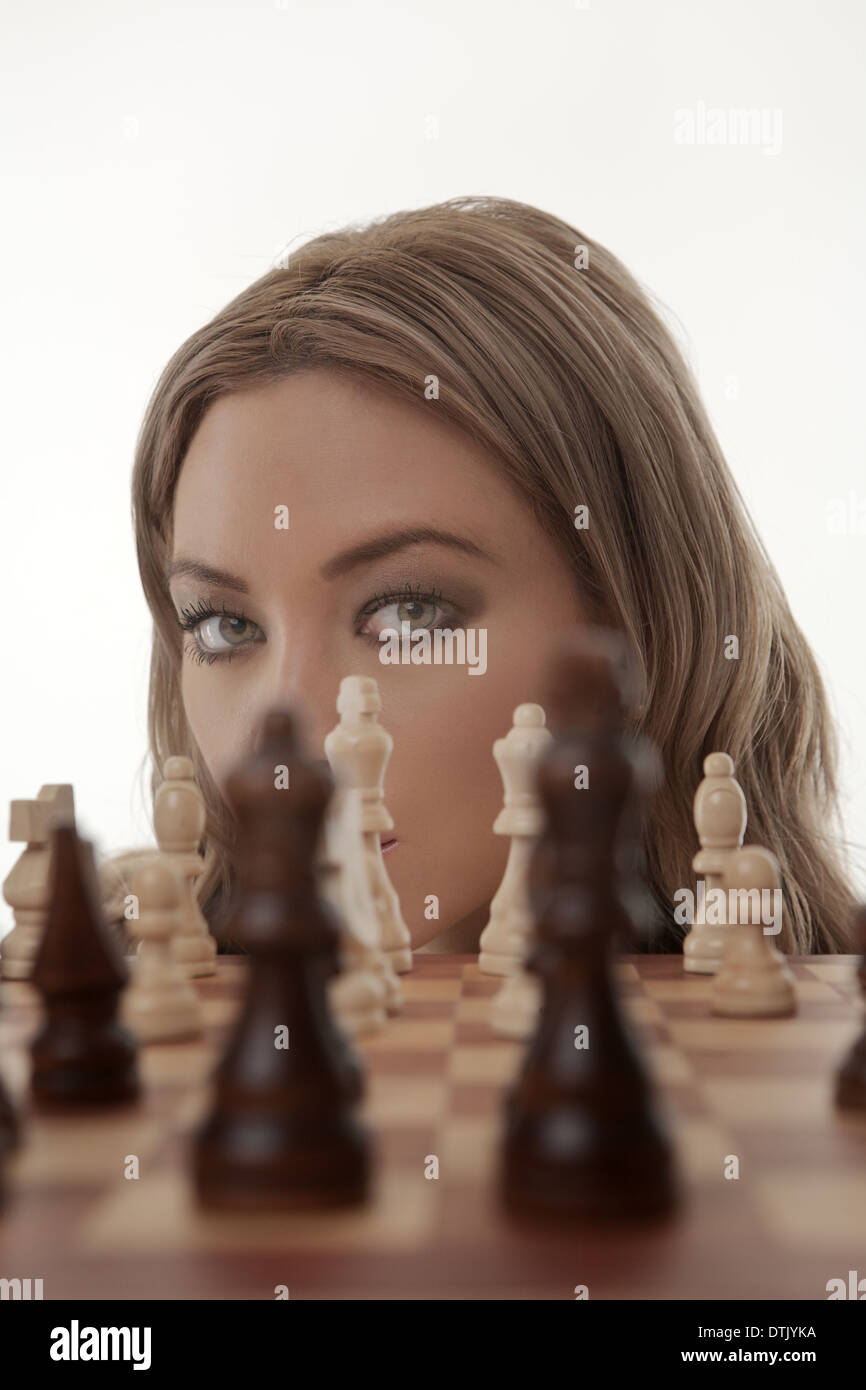 Image of a businesswoman playing chess shot in the studio Stock Photo