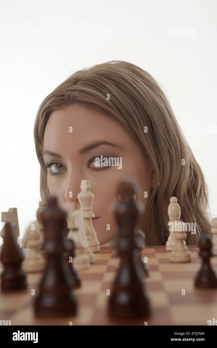 Image of a businesswoman playing chess shot in the studio Stock Photo