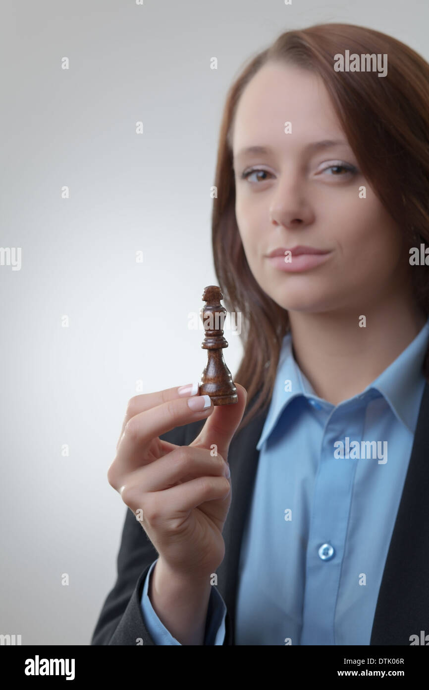 business woman planning her next move on a chess game  Stock Photo