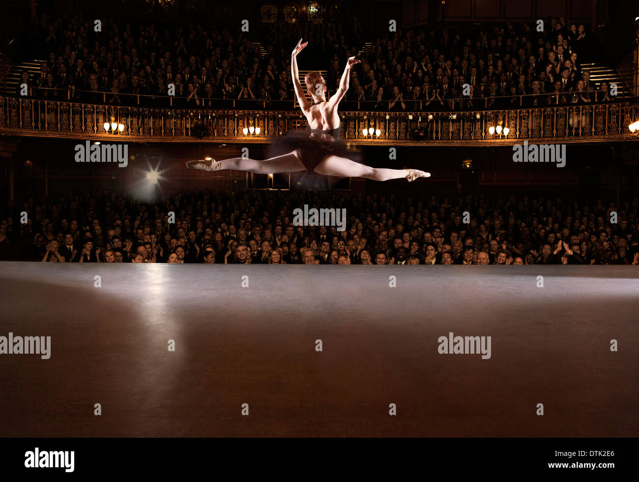 Ballet dancer performing on theater stage Stock Photo