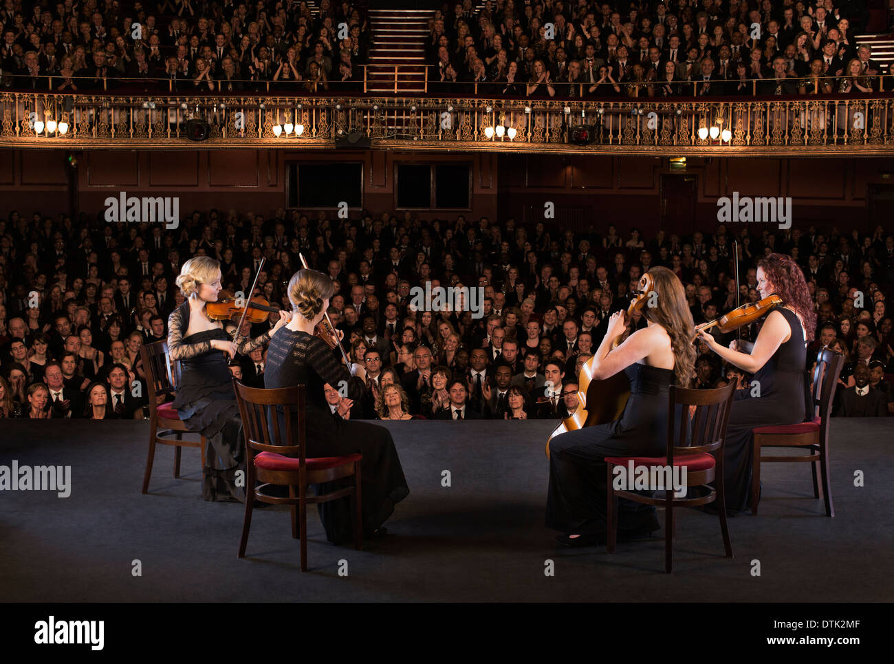 Quartet performing on stage in theater Stock Photo Alamy