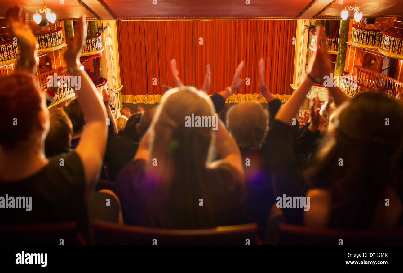 Audience clapping in theater Stock Photo