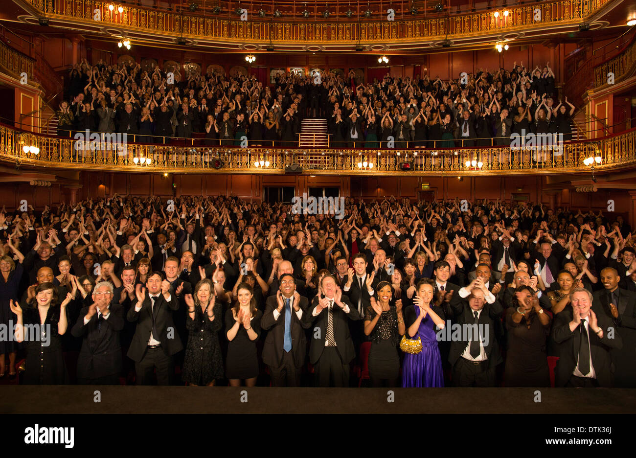 Audience applauding in theater Stock Photo