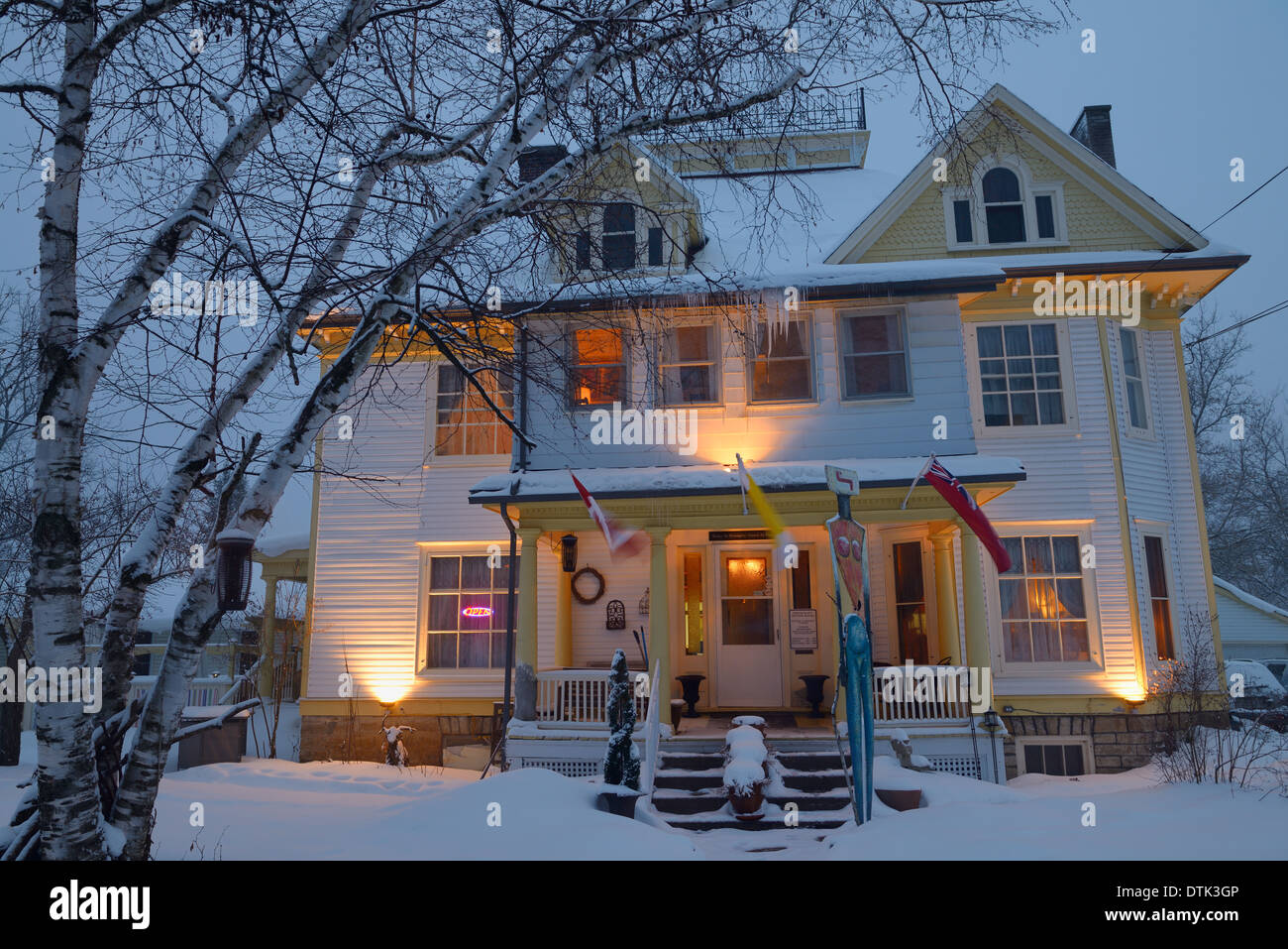 Snow covered heritage home at dusk in the small town of Marmora Ontario