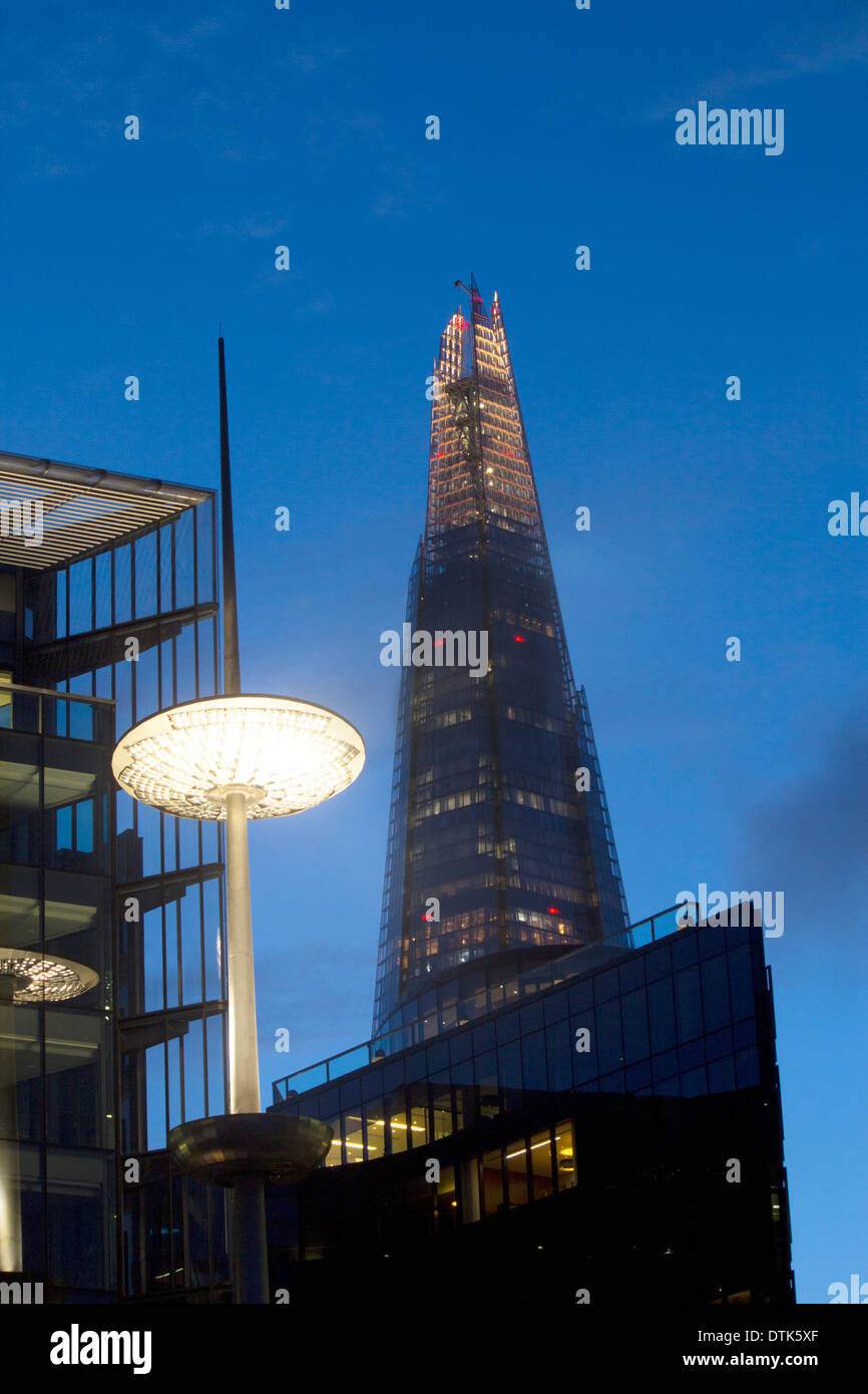 The Shard and light mast on More London building at night twilight dusk ...
