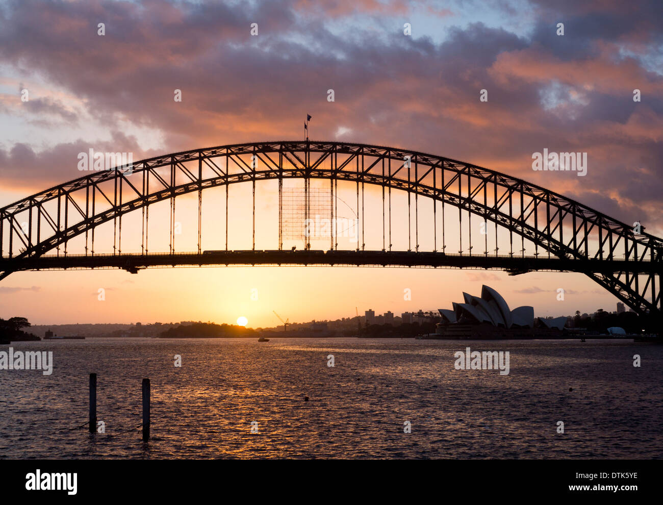 Sydney Harbour Bridge and Opera House at sunrise dawn from Blues Point Sydney New South Wales NSW Australia Stock Photo