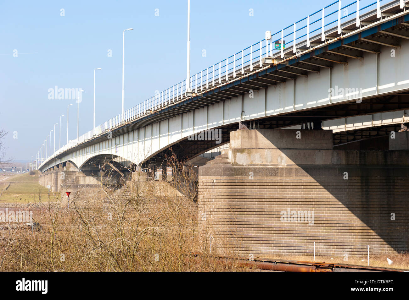 Dutch highway bridge with brick pillars crossing the river Rhine at the city of Arnhem, the