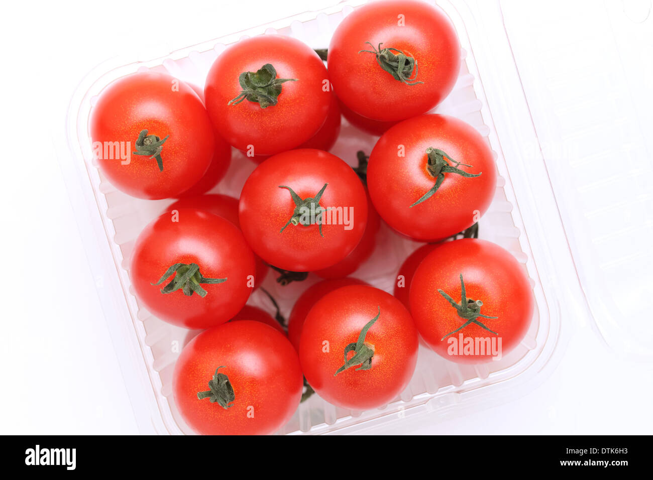 cherry tomatoes in a plastic container Stock Photo