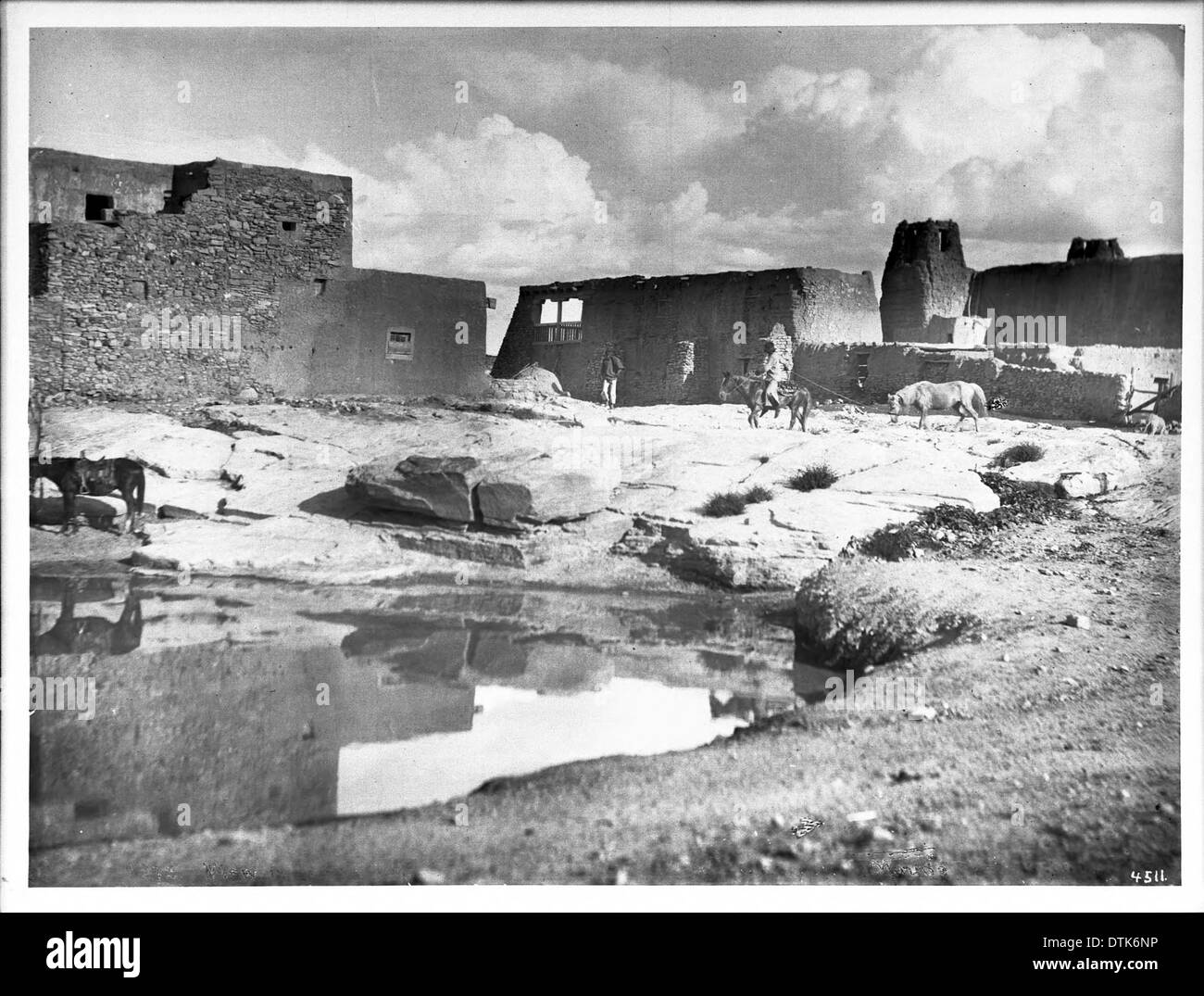 Reservoir for saving rain water at rear of old church, Acoma Pueblo, ca.1900 Stock Photo