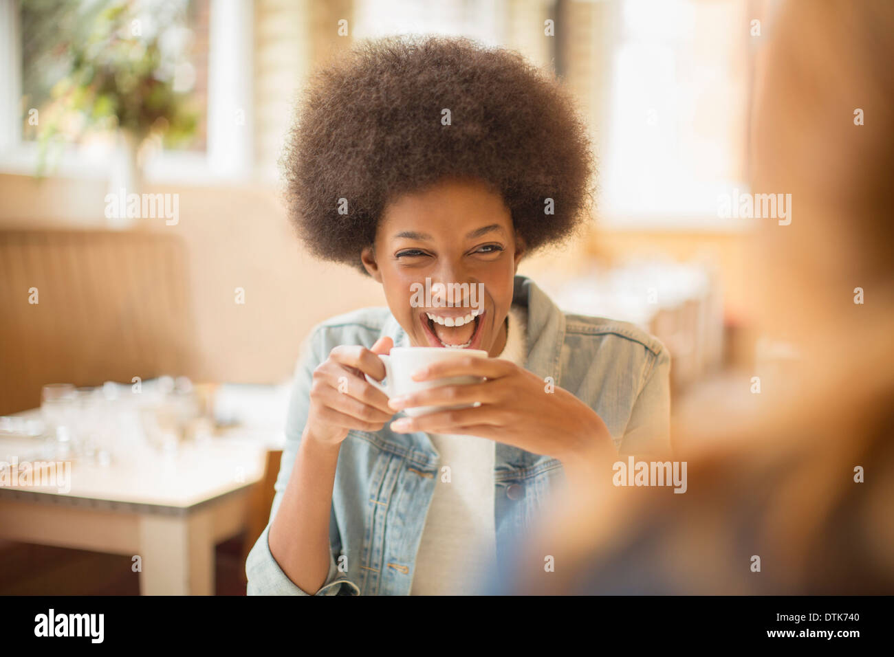 Women drinking coffee in cafe Stock Photo