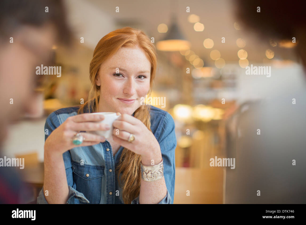 Friends enjoying coffee in cafe Stock Photo