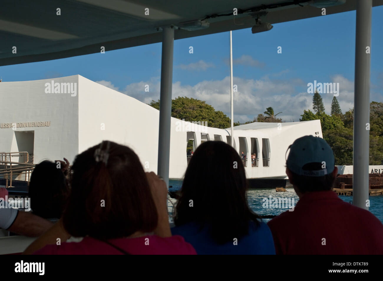 Tourist arriving by boat to the USS Arizona Memorial, Pearl Harbor, Oahu, Hawaii Stock Photo