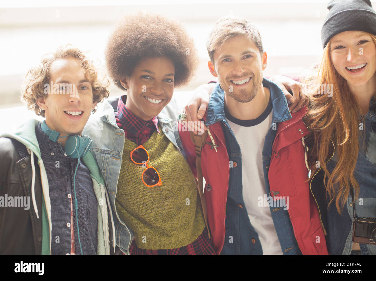 Friends smiling together outdoors Stock Photo - Alamy