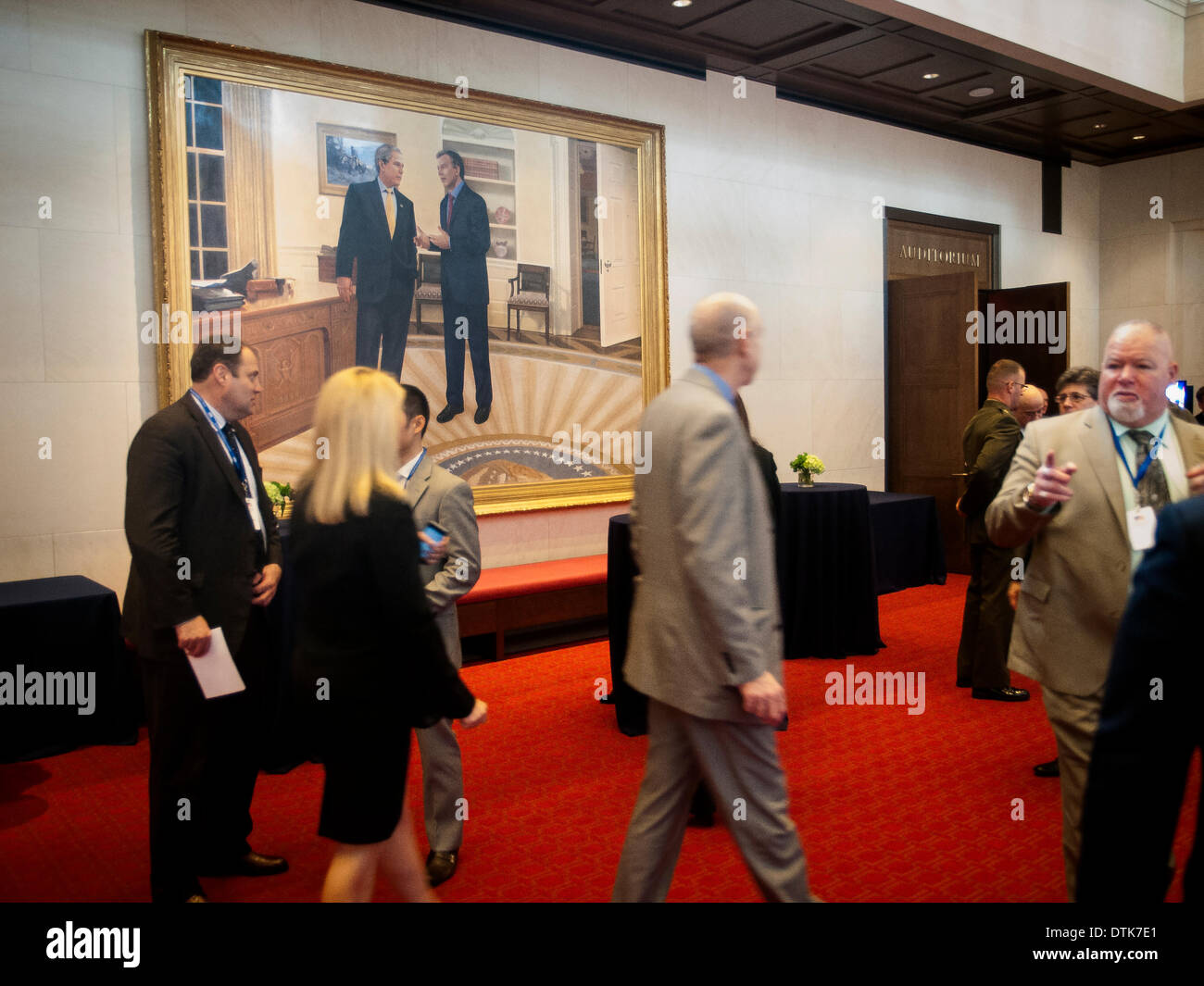 Dallas, TX, USA . 19th Feb, 2014. During a break at the Military Service Initiative Summit, attendees see a large painting of President George W. Bush talking to U.K. Prime Minister Tony Blair at the President George W. Bush Presidential Center in Dallas, TX Credit:  J. G. Domke/Alamy Live News Stock Photo