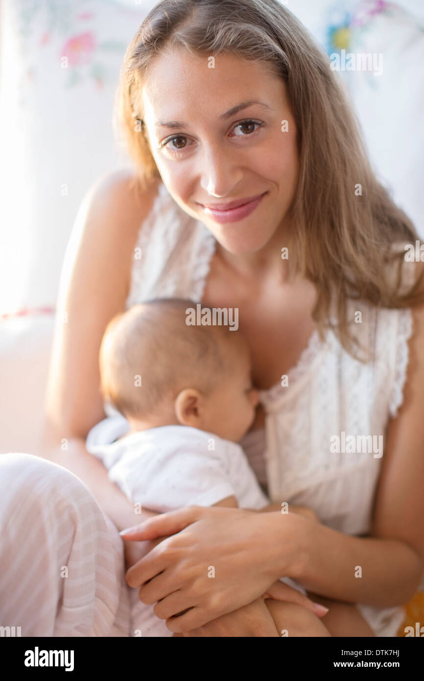 Mother holding baby boy Stock Photo