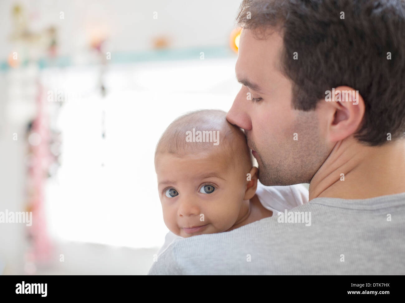Father kissing baby boy Stock Photo