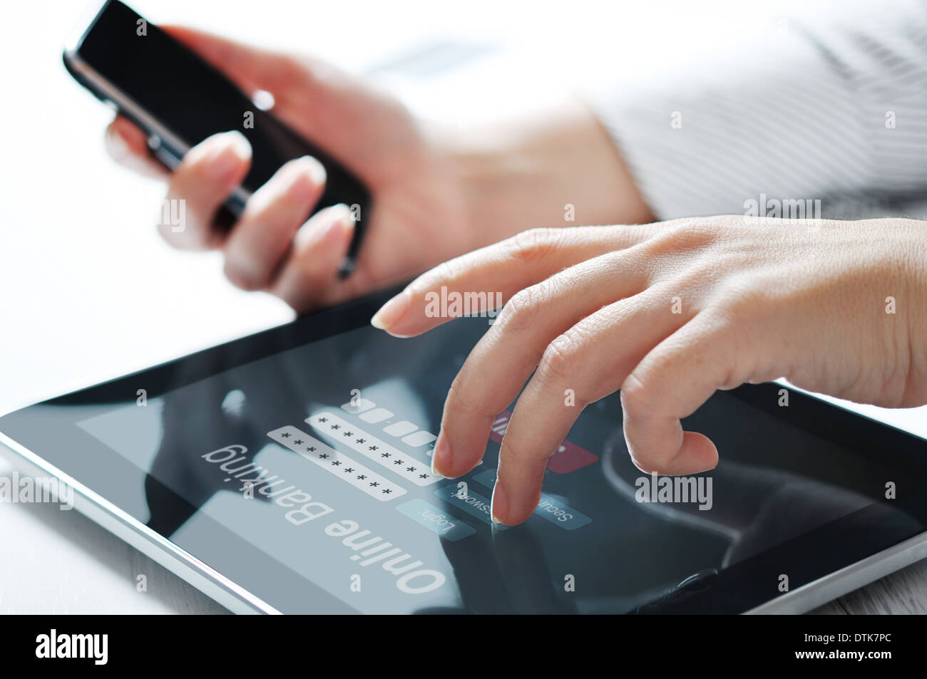 Female hands work with online banking on touch screen device Stock Photo