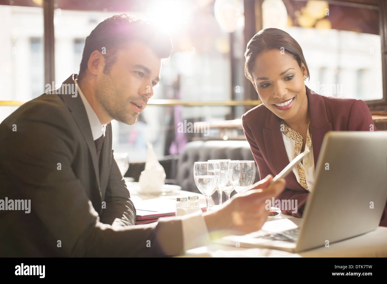 Business people working in restaurant Stock Photo