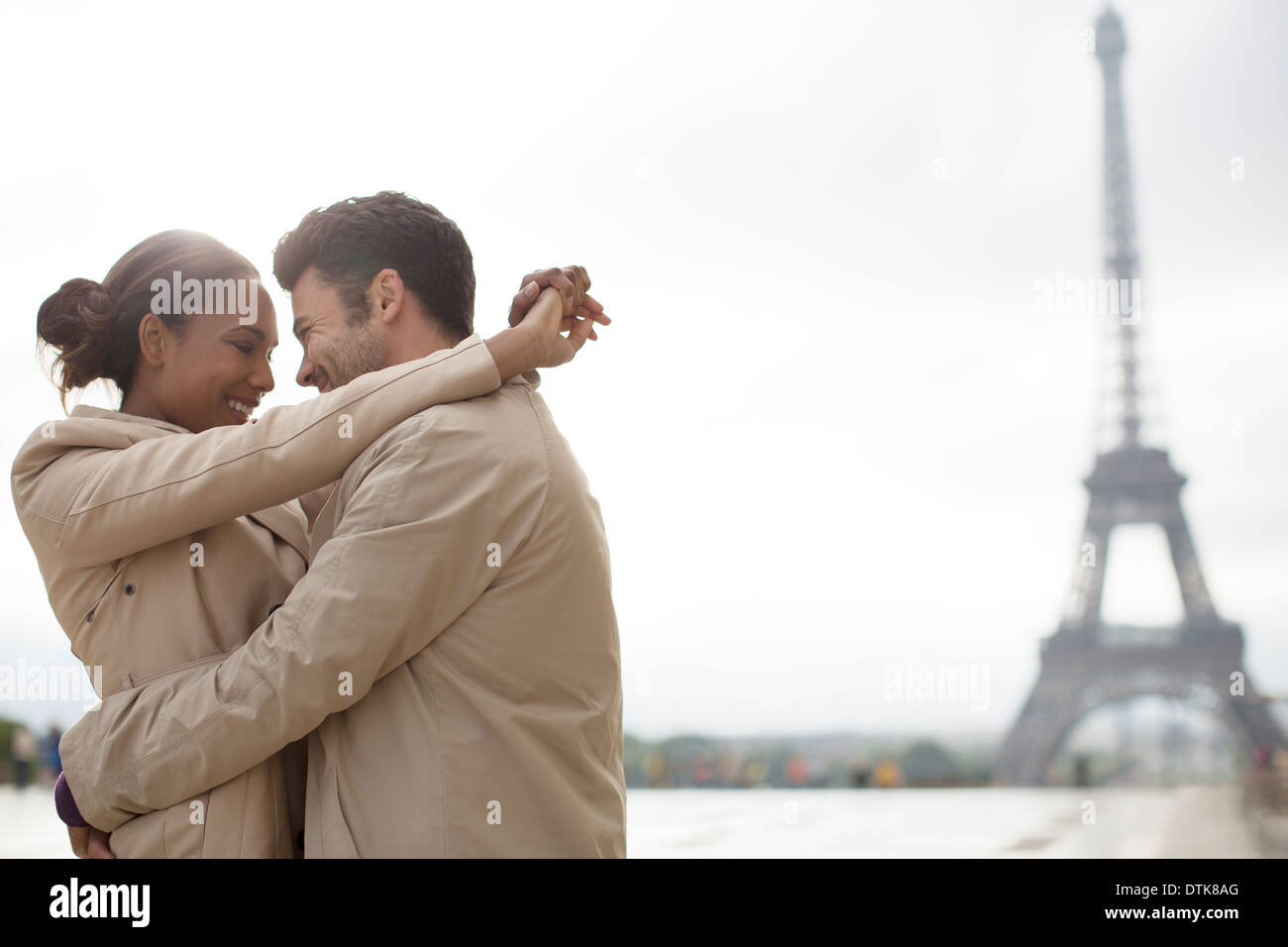 Couple hugging near Eiffel Tower, Paris, France Stock Photo Alamy