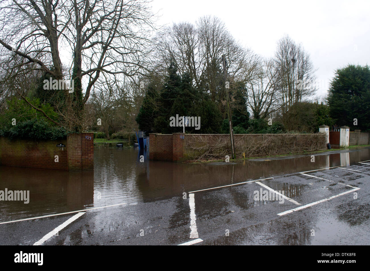 Flooded residential area and park in Staines. Driveway and streets flooded. Stock Photo