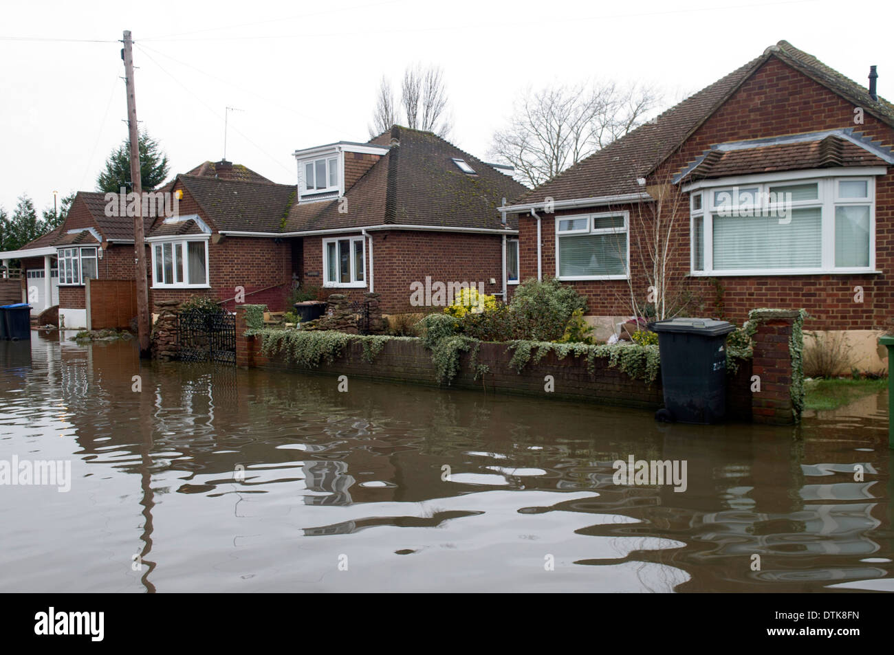 Flooded residential area and park in Staines. Driveway and streets flooded. Stock Photo