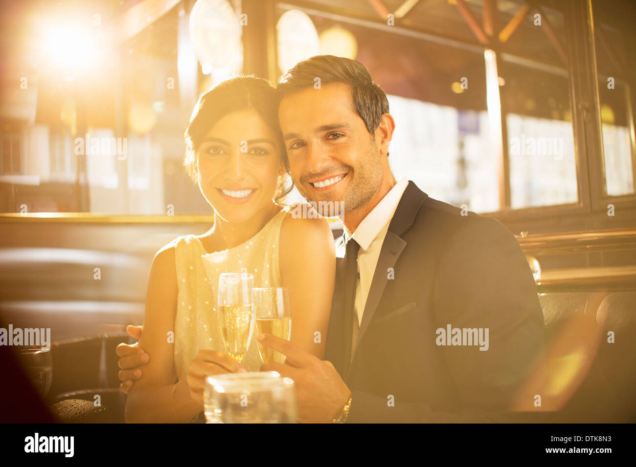 Couple toasting champagne flutes in restaurant Stock Photo Alamy