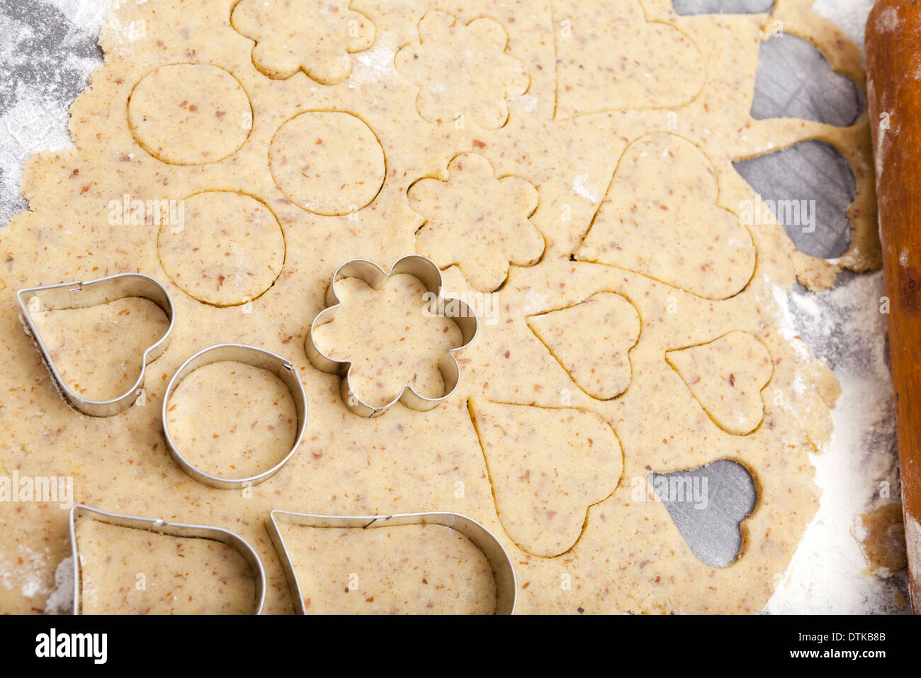 Cookie cutter in different shapes lie on cookie dough with Copy Space on  the upper area Stock Photo - Alamy