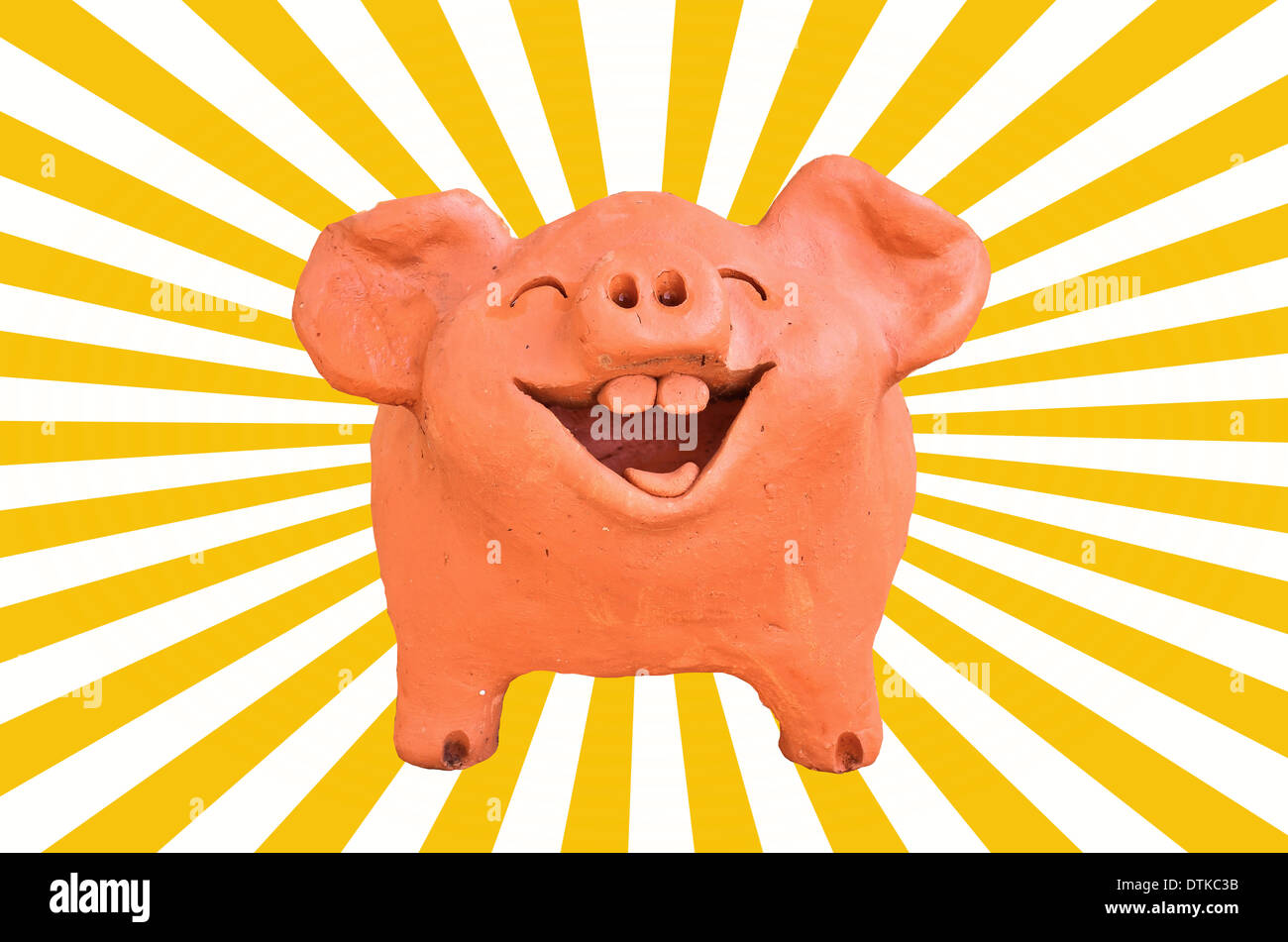 Laughing pig statue on sun beam Stock Photo