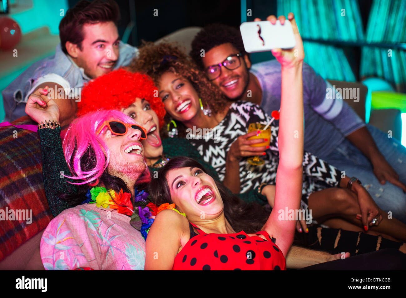 Friends using cell party hi-res stock photography and images - Alamy