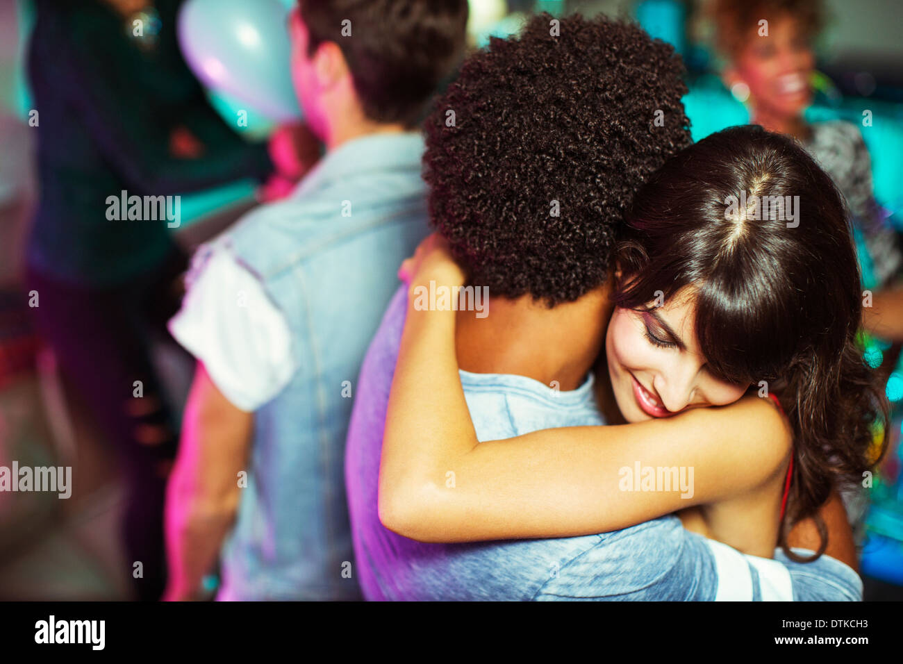 Couple dancing together at party Stock Photo