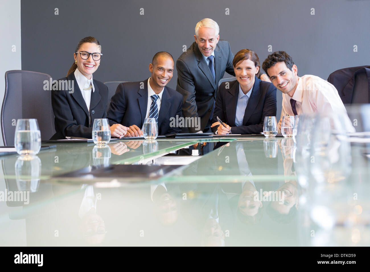 Business people smiling in meeting Stock Photo - Alamy