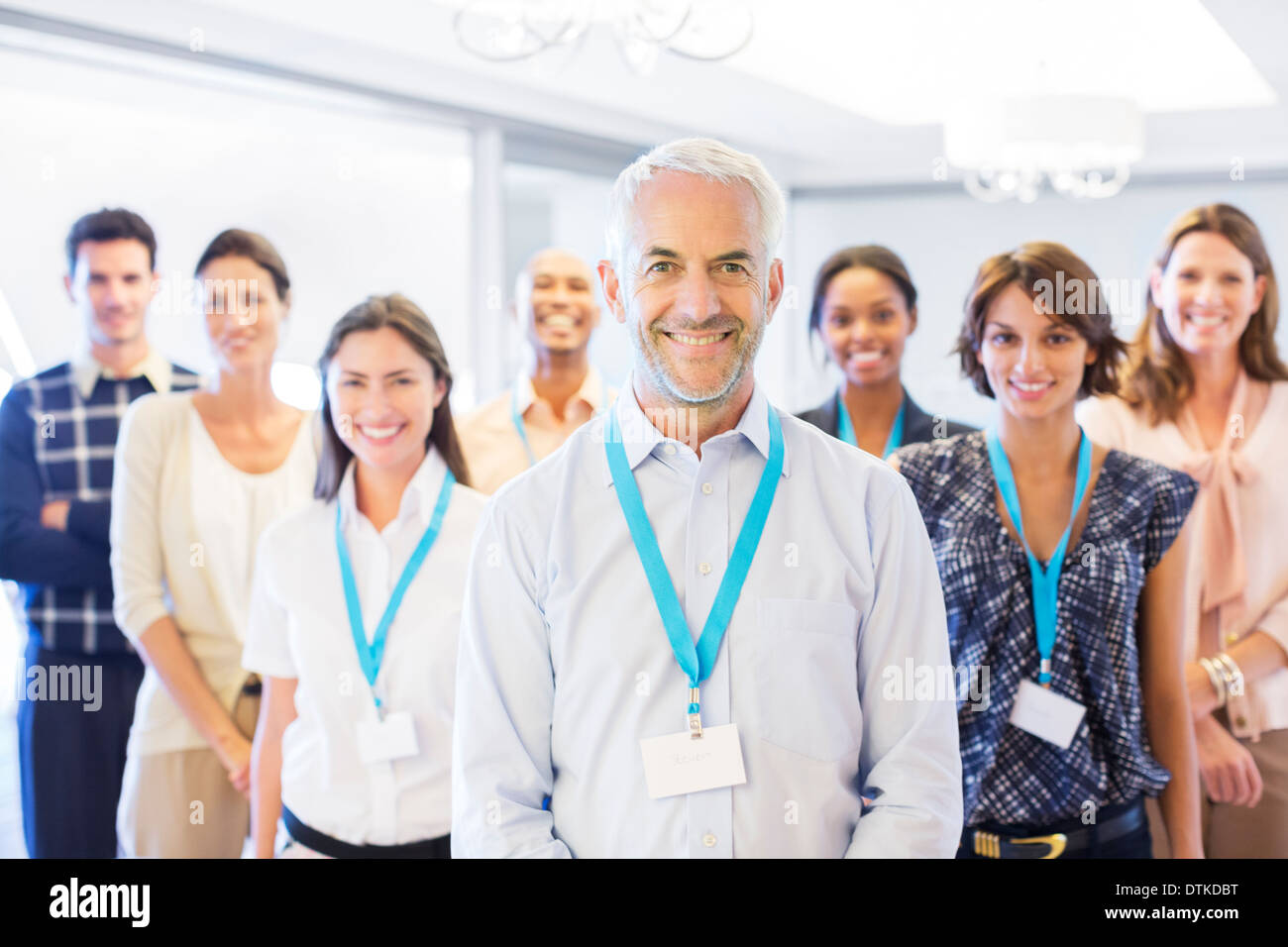 Business people smiling in office Stock Photo - Alamy