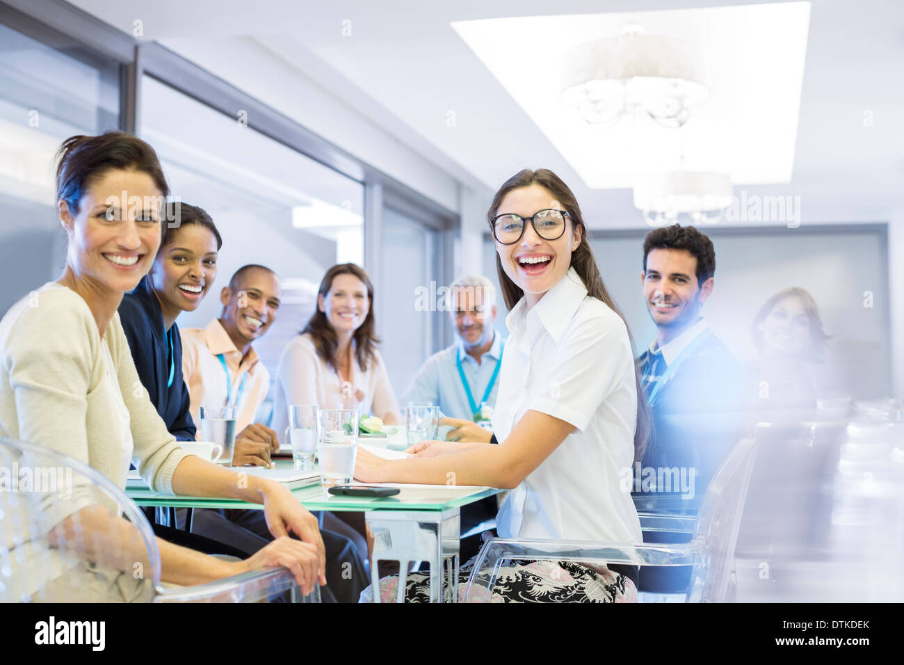 Business people smiling in meeting Stock Photo - Alamy